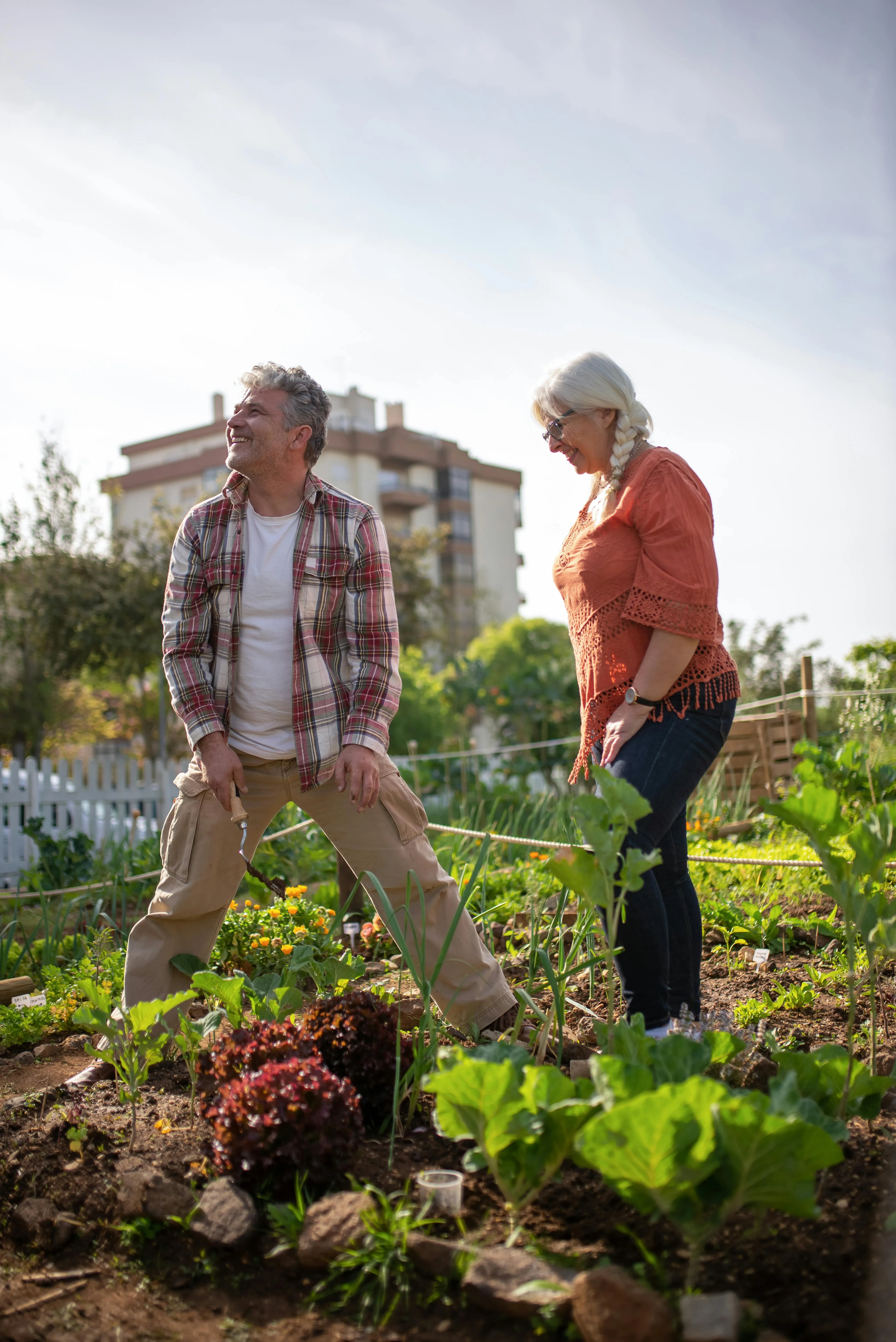 Couple gardening in field