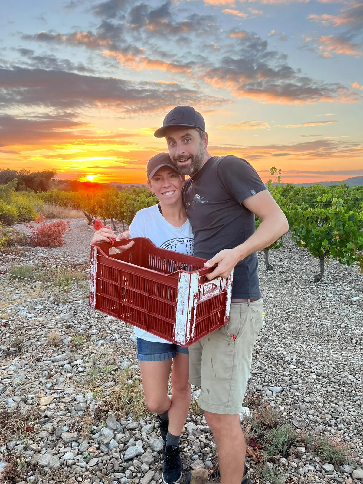 Couple at sunset with harvest crate